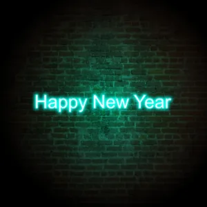 Vibrant Happy New Year neon signs glowing brightly, adding a lively and festive touch to New Year's Eve celebrations and decorations.