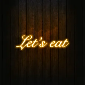 Modern kitchen with a vibrant neon sign, creating a stylish and retro ambiance.