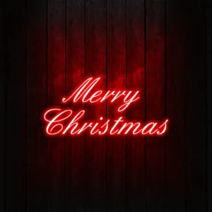 Festive lighted Christmas signs glowing warmly, creating a joyful and bright holiday atmosphere.